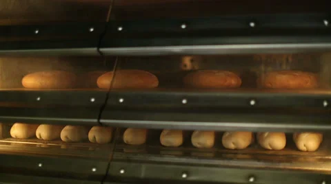Baking bread in the owen at bakery 2 Stock Footage 34072607