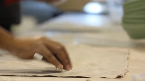 Baking bread proceed cleaning the dough from the textile   Stock Footage 54524309