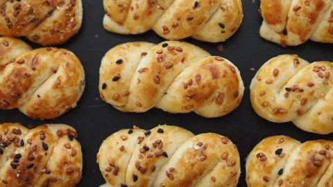 Baking bread with sesame seeds in a kitchen Stock Footage 340598266