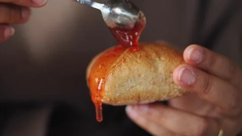 Baking bread with a sweet sauce at a local cafe Видео 336591361