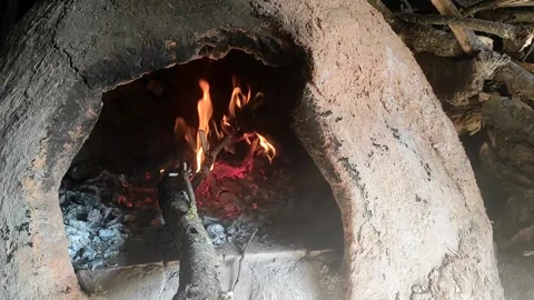 Baking bread in a traditional way in a wood fire oven and flatbread is Stock Footage 204775598
