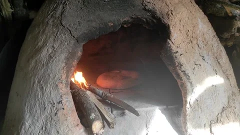 Baking bread in a traditional way in a wood fire oven and flatbread is Stock Footage 204775602