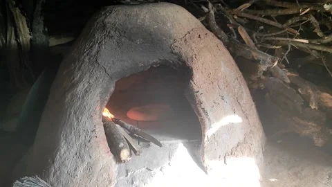 Baking bread in a traditional way in a wood fire oven and flatbread is Stock Footage 204775609