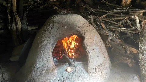 Baking bread in a traditional way in a wood fire oven and flatbread is Stock Footage 204776205