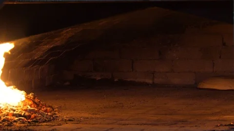 Baking bread in a traditional wood-burning oven. Stock Footage 107273849