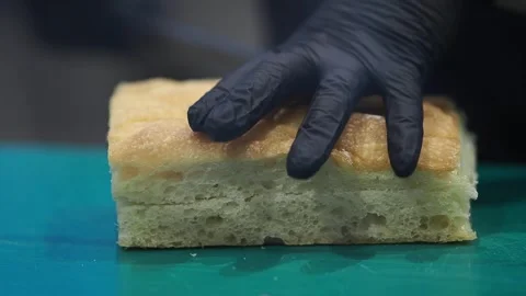 Baking bread using a large piece of dough on a green cutting board Video stock 346113884