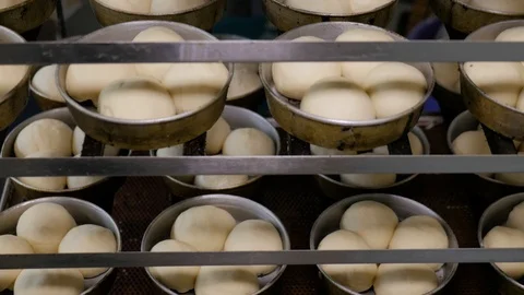 Baking buns in industrial restaurant kitchen. Stock Footage 109473079