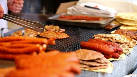 Baking burgers on a grill Stock Footage 86083191