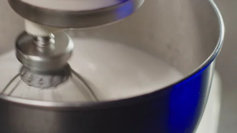 Baking a cake, close up of a working mixer in the kitchen. Stock Footage 149122909