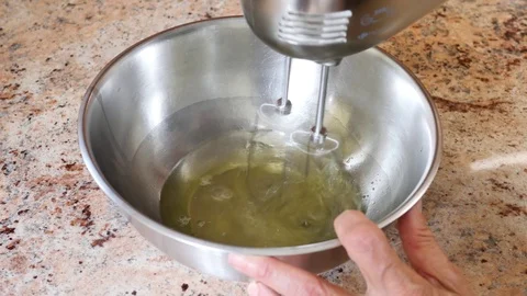 Baking a cake. The eggs are beaten. Stock Footage 94959237