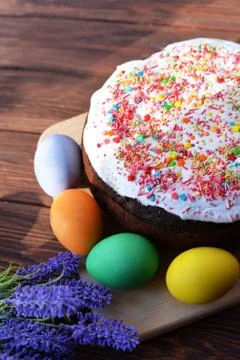 Baking cake with icing glaze bread with eggs in a basket colored Stock Photos