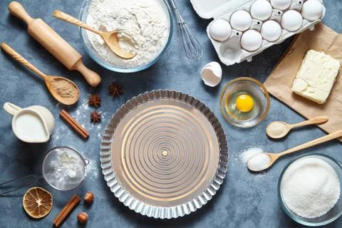 Baking cake in kitchen - dough recipe ingredients eggs, flour, milk, butter Stock Photos