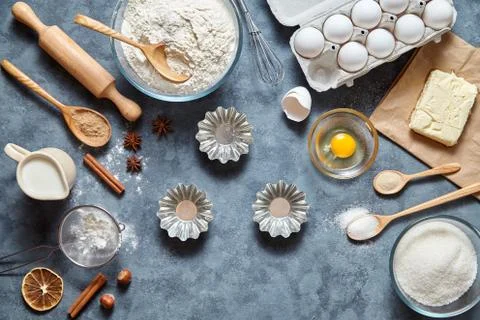Baking cake in kitchen - dough recipe ingredients eggs, flour, milk, butter Stock Photos
