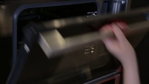 Baking a cake with a pot holder Stock Footage 74057758