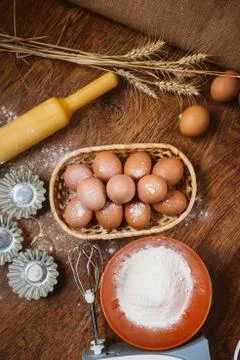 Baking cake in rural kitchen - dough  recipe ingredients (eggs, flour, sugar) Stock Photos