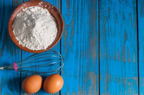 Baking cake in rural kitchen - dough recipe ingredients eggs, flour and whi.. Stock Photos