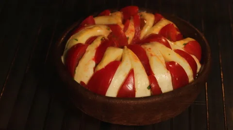 Baking cheese and tomato on clay pan time lapse Stock Footage 63634070