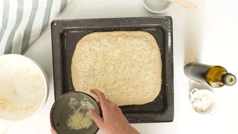 Baking cheese bread step by step. Topping bread dough with cheese. Stock Footage 119958757