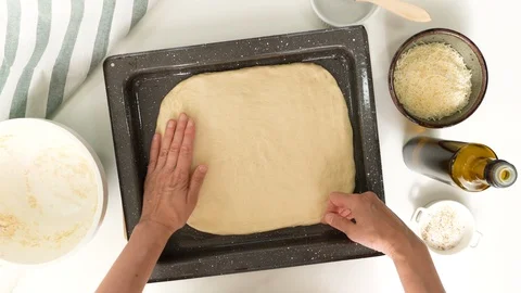 Baking cheese bread step by step. Woman gently unfurl dough onto prepared baking Stock Footage 119961561
