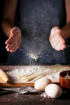 Baking Chef Dusting Flour In Rustic Kitchen Stock Photos