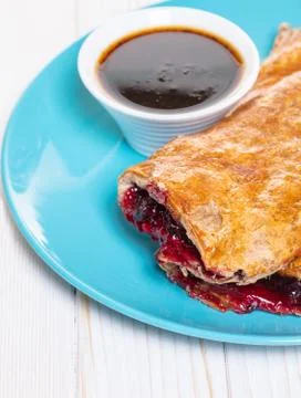 Baking, cherry strudel in a plate Foto stock