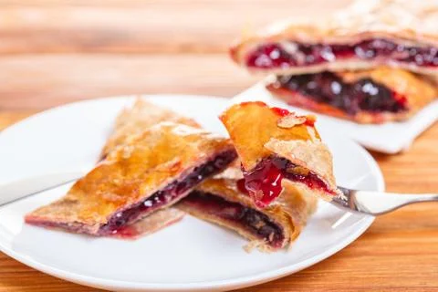 Baking, cherry strudel in a plate Stock Photos