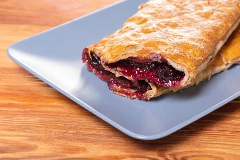 Baking, cherry strudel in a plate Foto stock