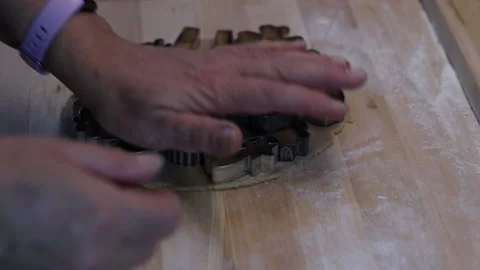 Baking Christmas candy. Women's hands shape using stamps, interesting patterns l Stock Footage 160158083