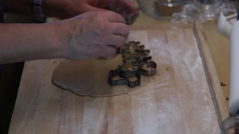 Baking Christmas candy. Women's hands shape using stamps, interesting patterns l Stock Footage 160158092