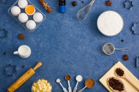 Baking composition eggs flour milk butter spices kitchen tools Stock Photos