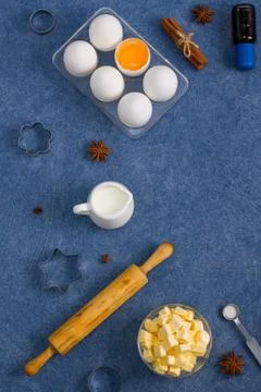 Baking composition eggs milk butter spices vanilla kitchen tools Stock Photos
