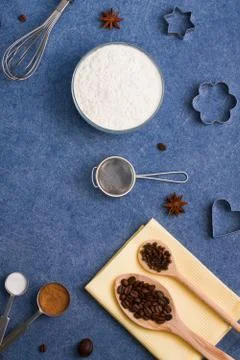 Baking composition flour spices kitchen tools wooden spoons Stock Photos