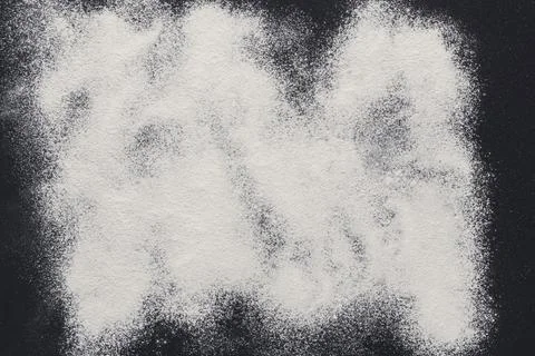 Baking concept on black background, sprinkled flour with copy space Stock Photos