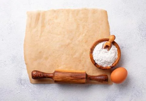 Baking concept. Rolling pin, flour and egg Stock Photos