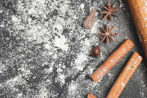 Baking concept, rolling pin, star anise, nuts, cinnamon stick and piece of ch Stock Photos