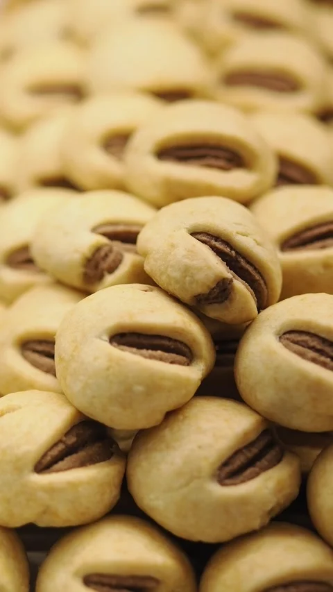 Baking cookies at a local bakery during the afternoon Stock Footage 342380494