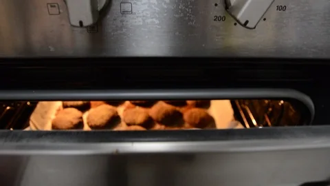 Baking cookies in the oven. close up low light Stock-Footage 119086083