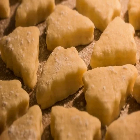 Baking cookies in the shape of a Christmas tree Stock Footage 69460972