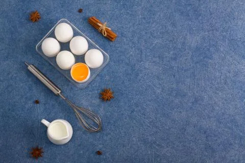 Baking cooking composition eggs milk cinnamon anise whisk coffee beans Stock Photos