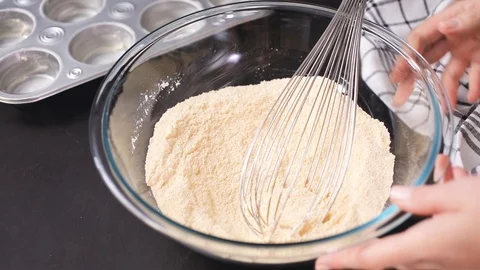 Baking cornbread muffins in metal muffin tin. Stock Footage 96354867