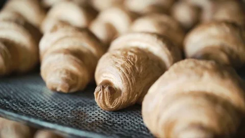 Baking crescent rolls in the oven in 4K Video stock 70684535
