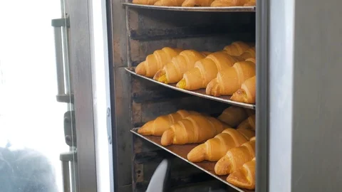 Baking croissants in the oven. Stock Footage 108634942
