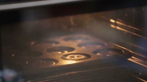 Baking cupcake in the oven Stock Footage 62447734