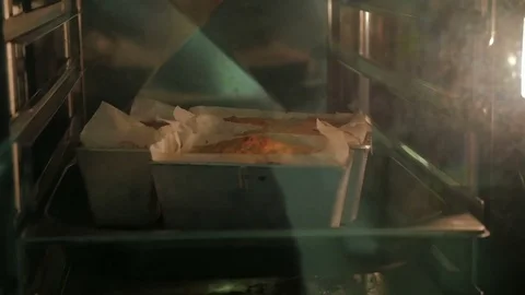 Baking cupcake in the oven. View from the outside of the oven. Stock Footage 74405310
