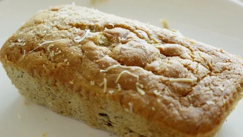 Baking delicious coconut bread kitchen food home environment close-up culinary Stock Footage 302892438