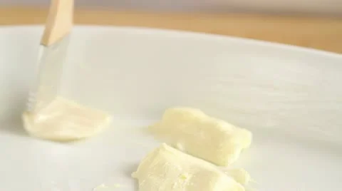 A baking dish being brushed with butter Video stock 24664730