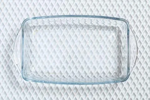 A baking dish cleaned from thick layer of carbon. Glassware for baking after Stock Photos