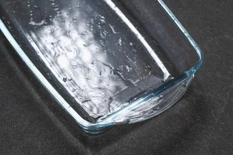 A baking dish cleaned from thick layer of carbon. Glassware for baking after Stock Photos