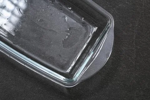 A baking dish cleaned from thick layer of carbon. Glassware for baking after Stock Photos