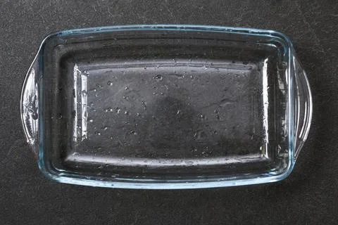 A baking dish cleaned from thick layer of carbon. Glassware for baking after Stock Photos